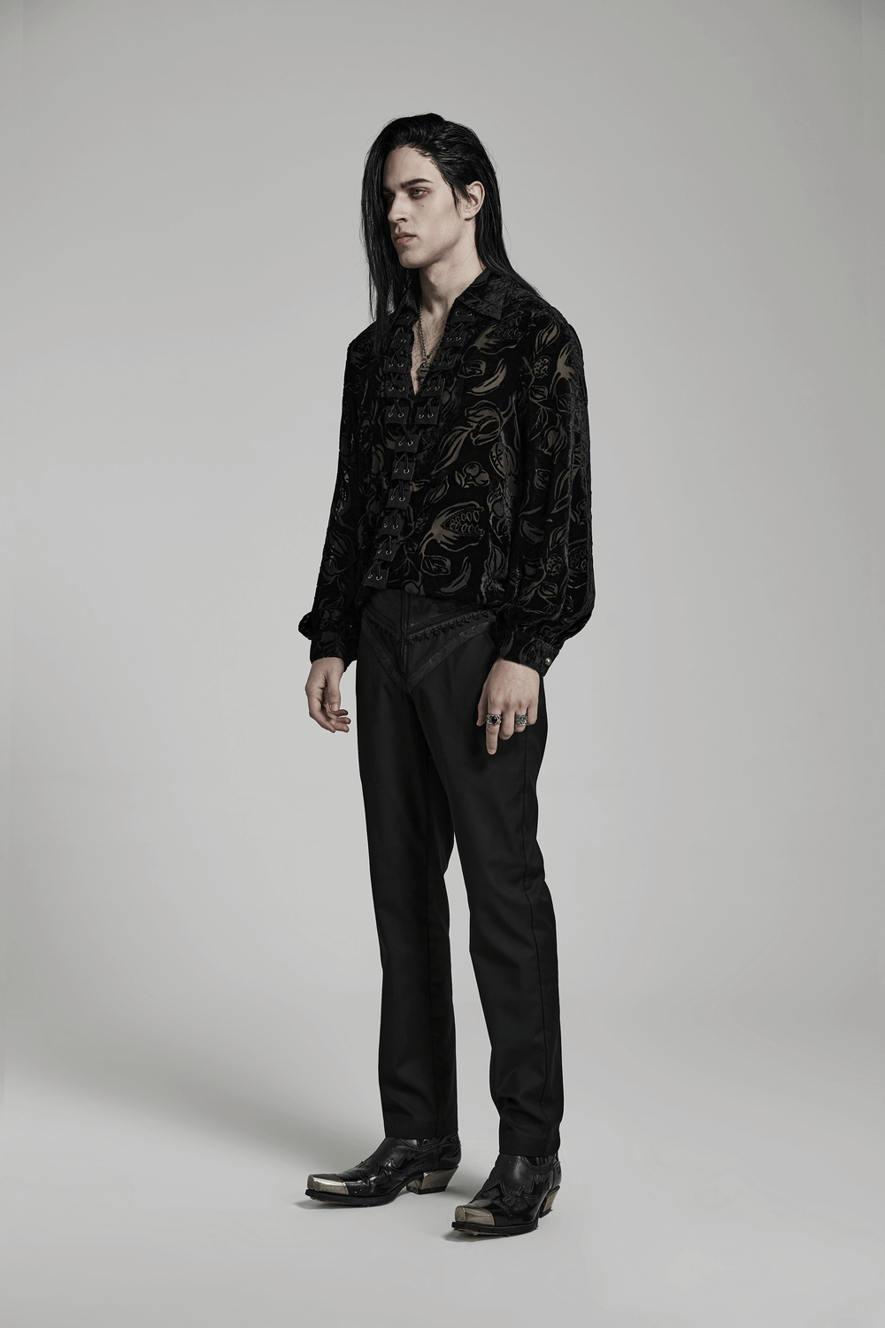 Model showcasing elegant gothic slim-fit jacquard pants with a stylish black shirt and gothic details.