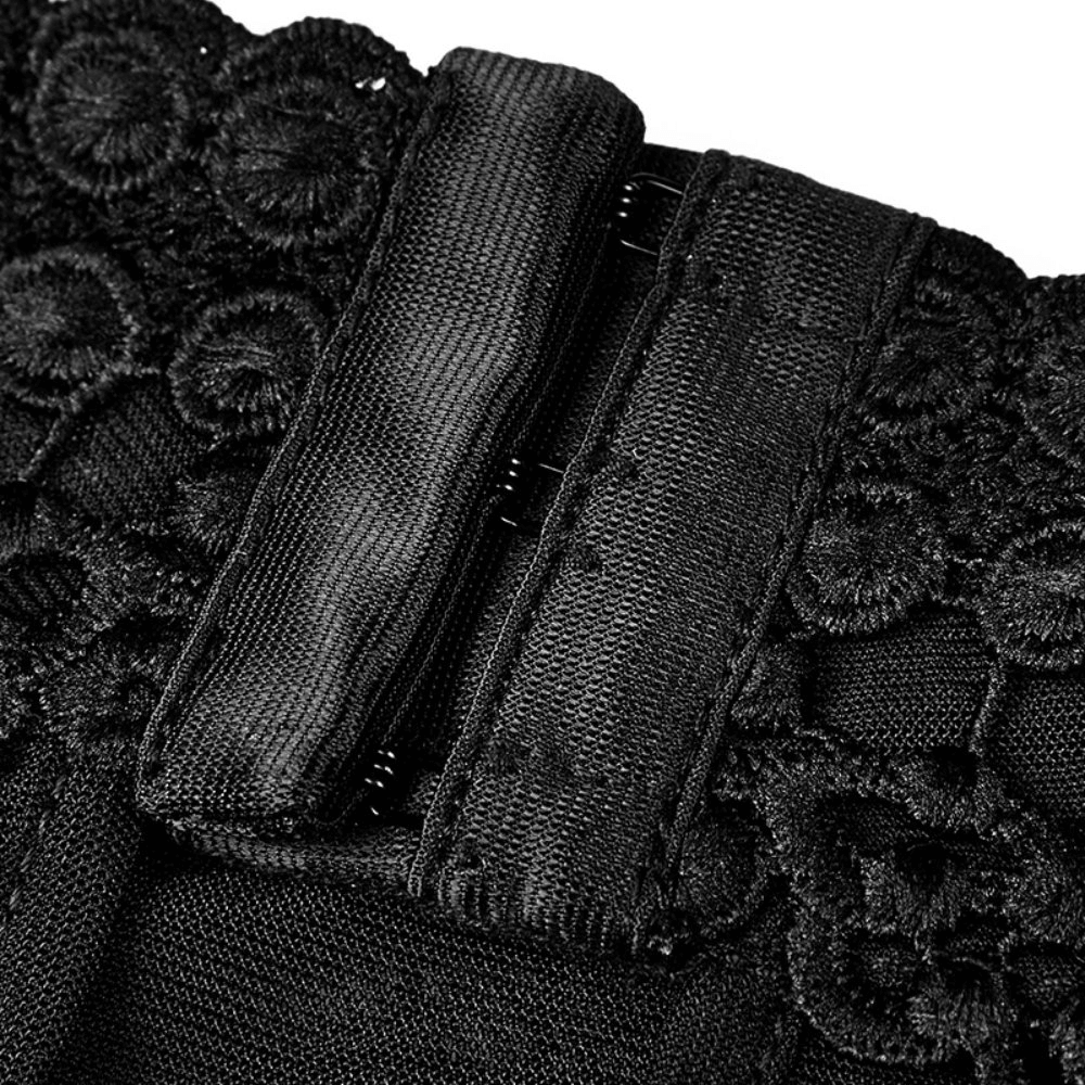 Close-up of the adjustable back buckle on an elegant black lace tank top.