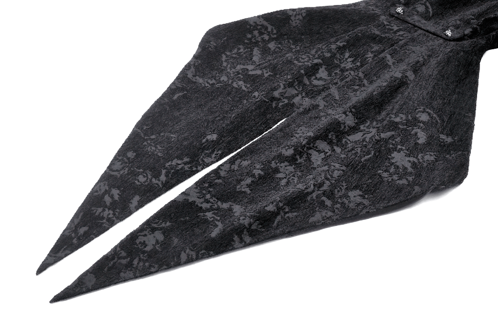 Elegant black lace fabric detail of a Victorian Gothic tailcoat with dramatic ruffled layers.