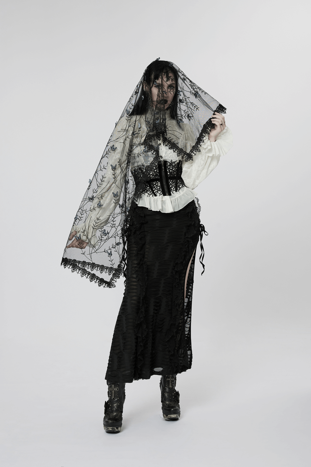 Elegant gothic black lace butterfly veil worn with vintage attire, perfect for dramatic flair and special occasions.