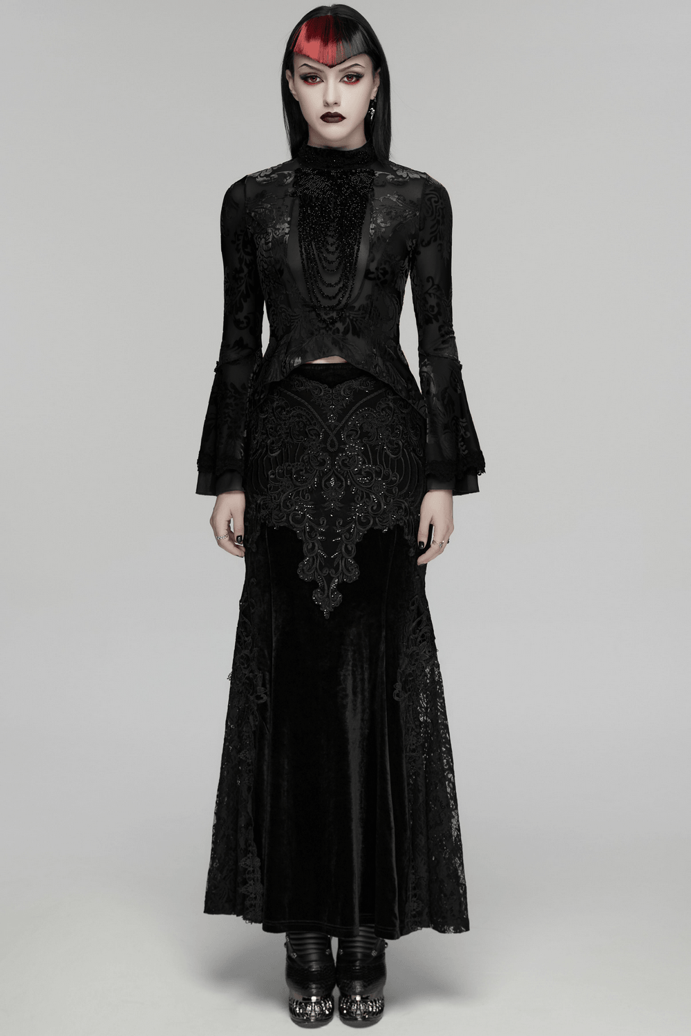 Elegant Gothic Top With Beaded Plunge and Lace Back worn by a model in a striking black outfit.