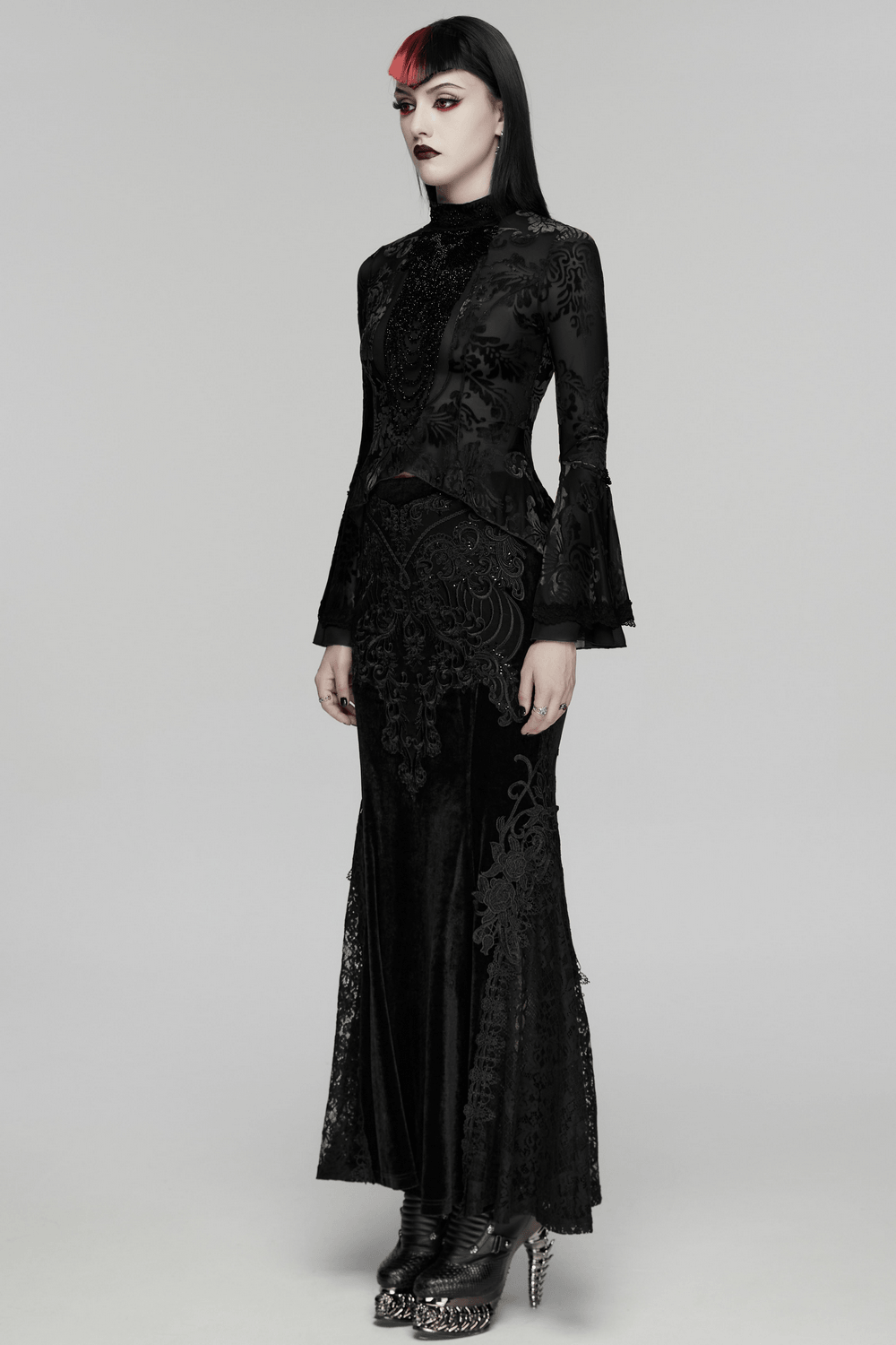 Elegant Gothic Top With Beaded Plunge and Lace Back worn by a model in a dramatic black outfit.