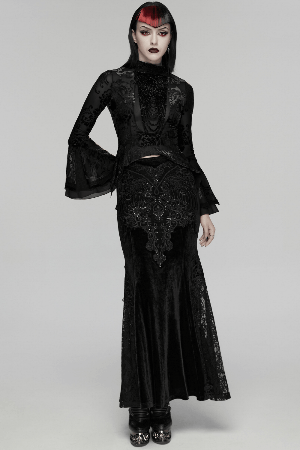 Elegant Gothic Top With Beaded Plunge and Lace Back worn with a stunning black skirt, showcasing intricate lace detailing.