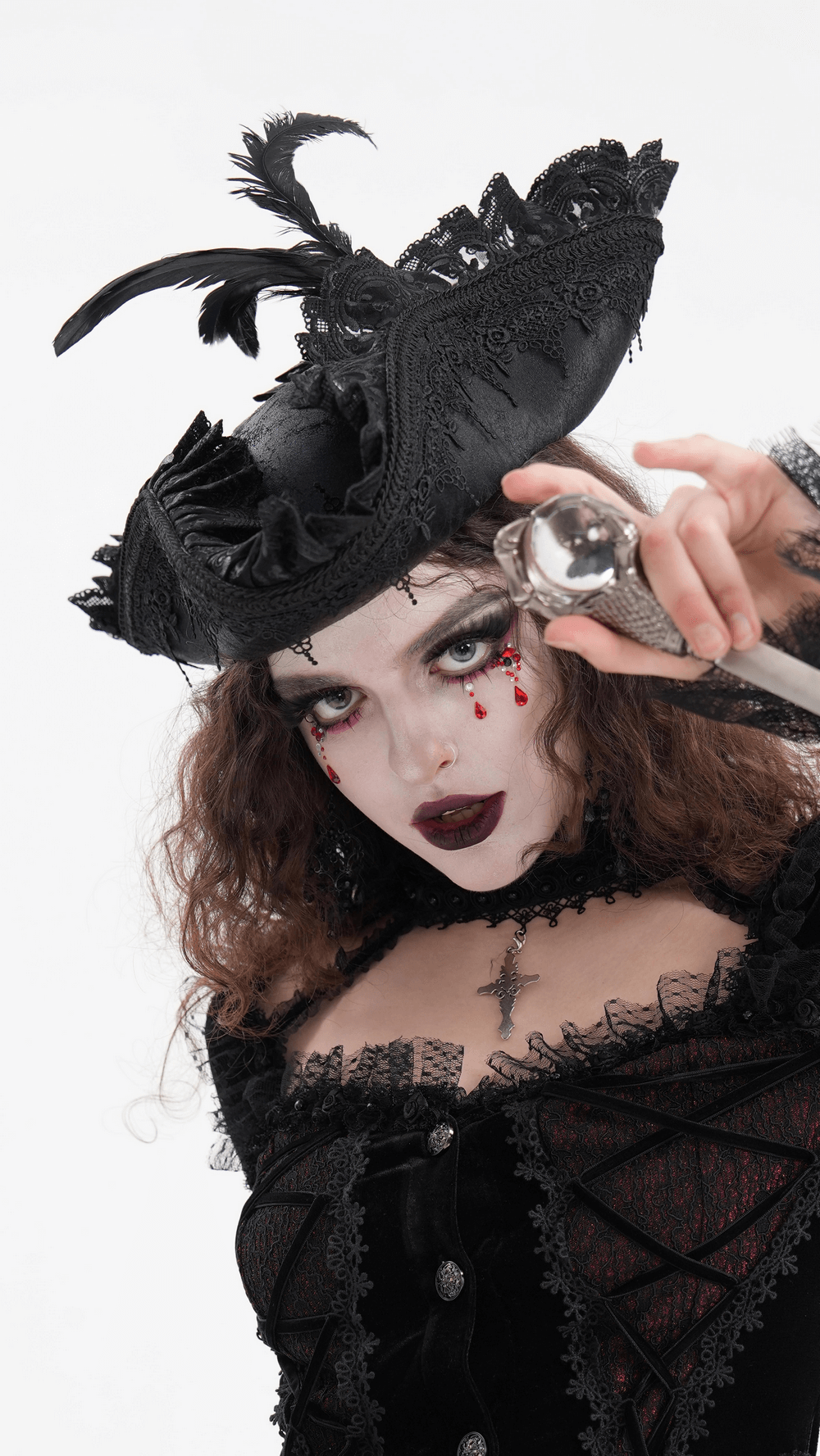 Gothic model wearing an elegant tricorn hat with lace and feather accents, showcasing a striking look for cosplay.
