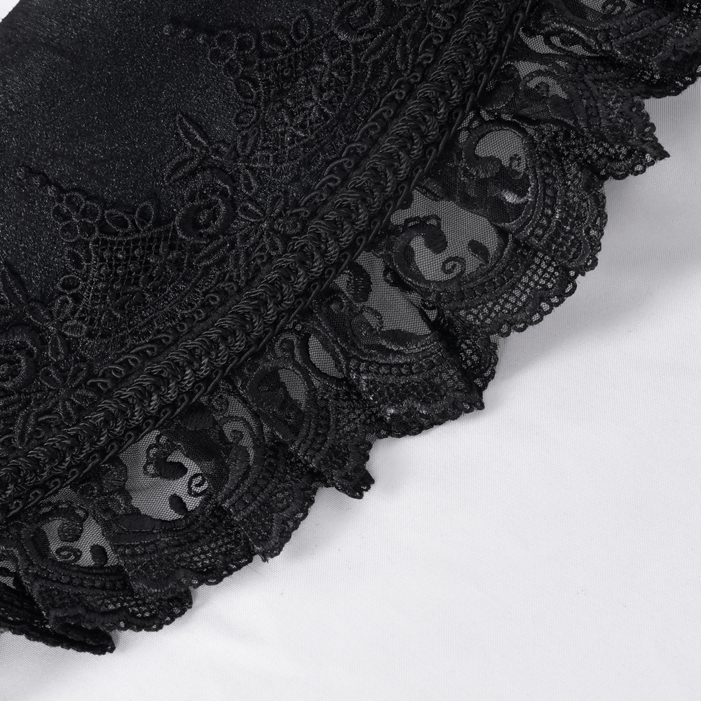 Close-up of intricate black lace detailing with a scalloped edge, perfect for gothic or Victorian-inspired fashion.