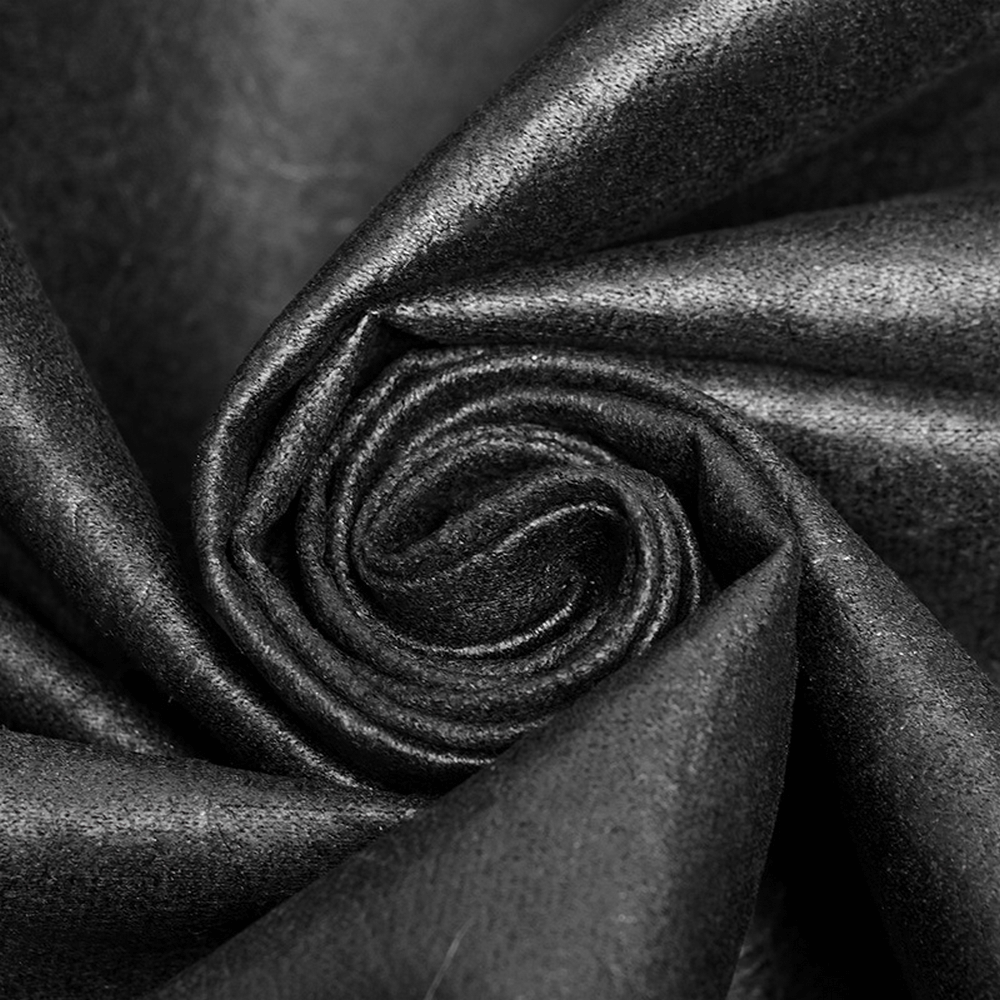 Close-up of luxurious black velvet fabric, ideal for gothic clothing and elegant designs.