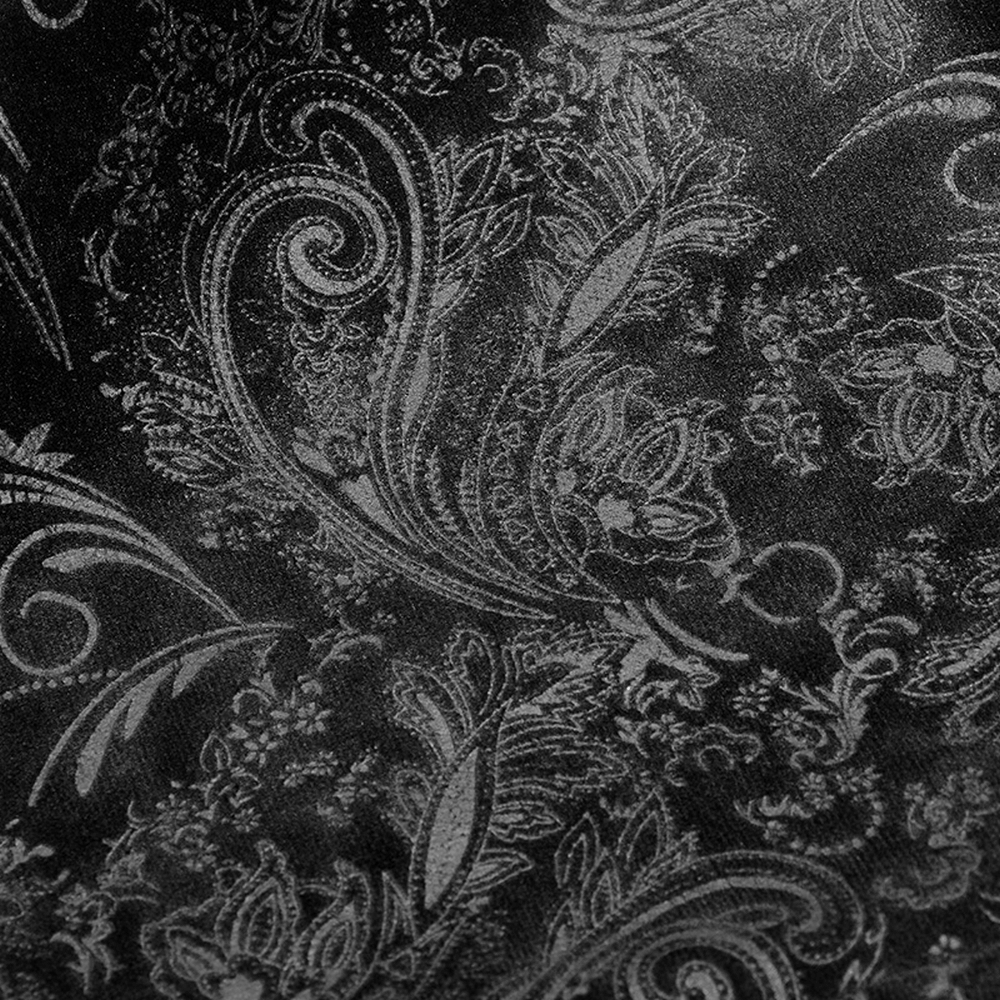 Close-up of luxurious embossed paisley velvet fabric in dark tones, perfect for elegant Gothic designs.