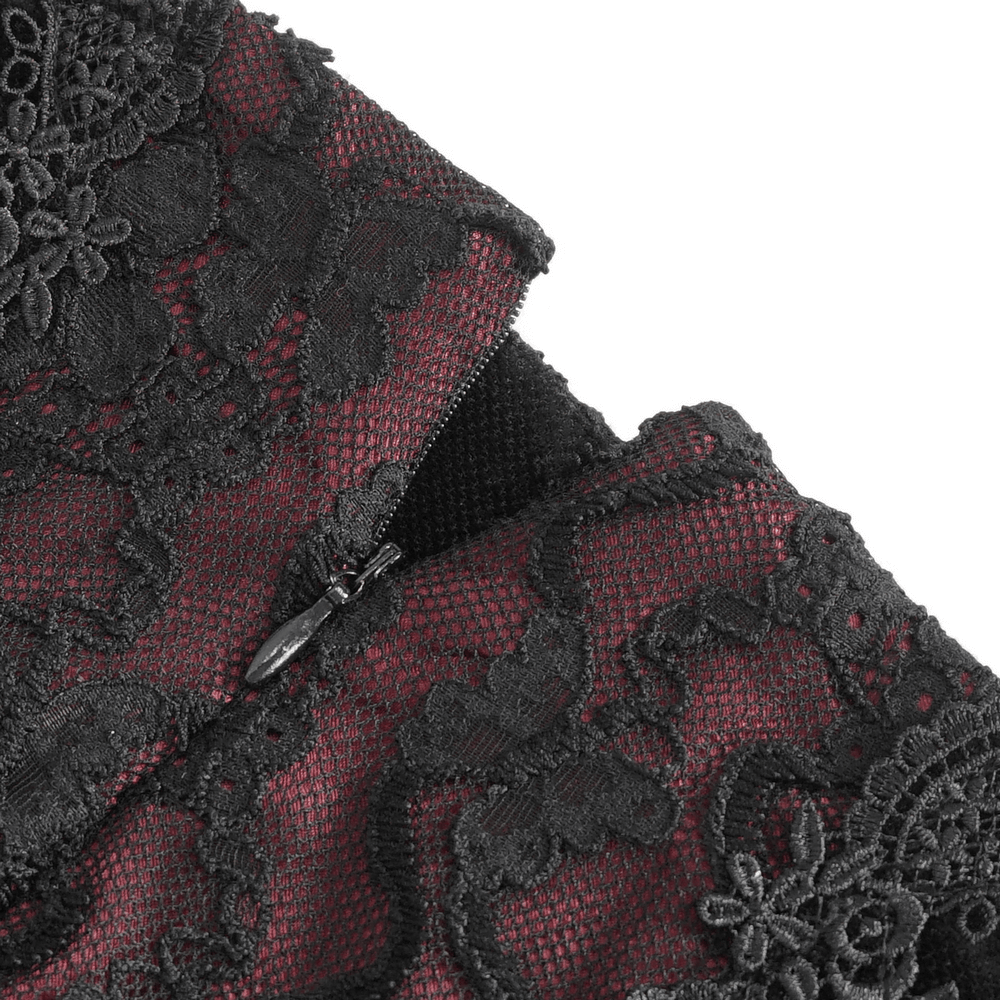 Close-up of black lace detail and zipper on an elegant gothic velvet skirt for women, showcasing intricate patterns.