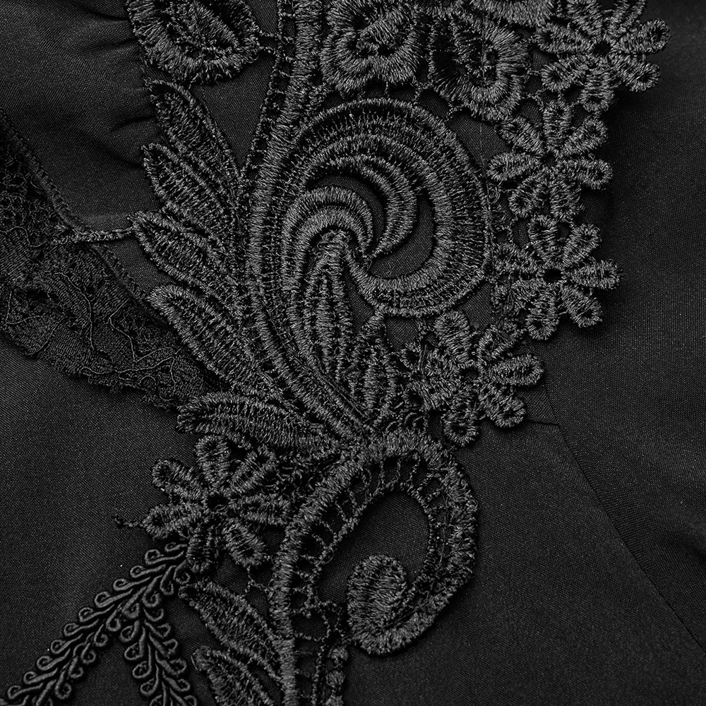 Close-up of intricate black lace embroidery showcasing elegant floral designs and gothic details.