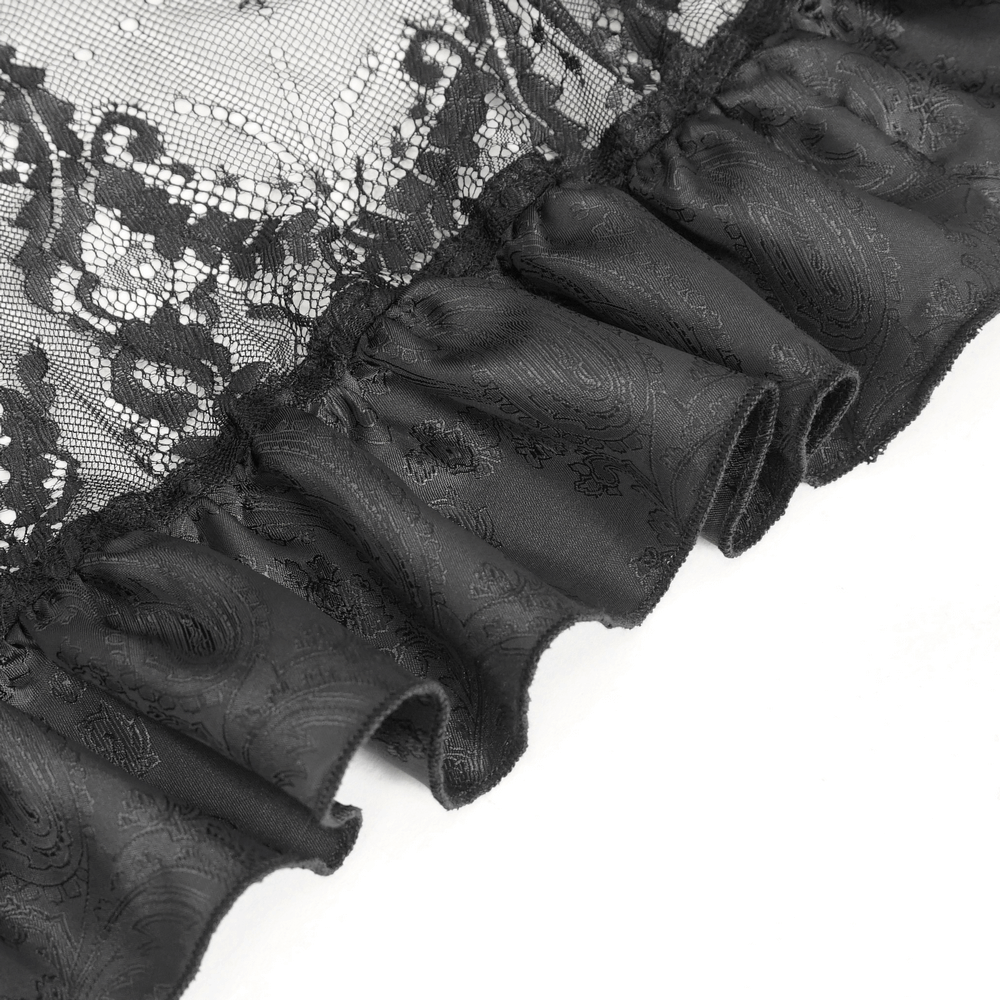 Close-up of elegant black lace skirt ruffles featuring intricate floral patterns and lavish texture for Gothic style.