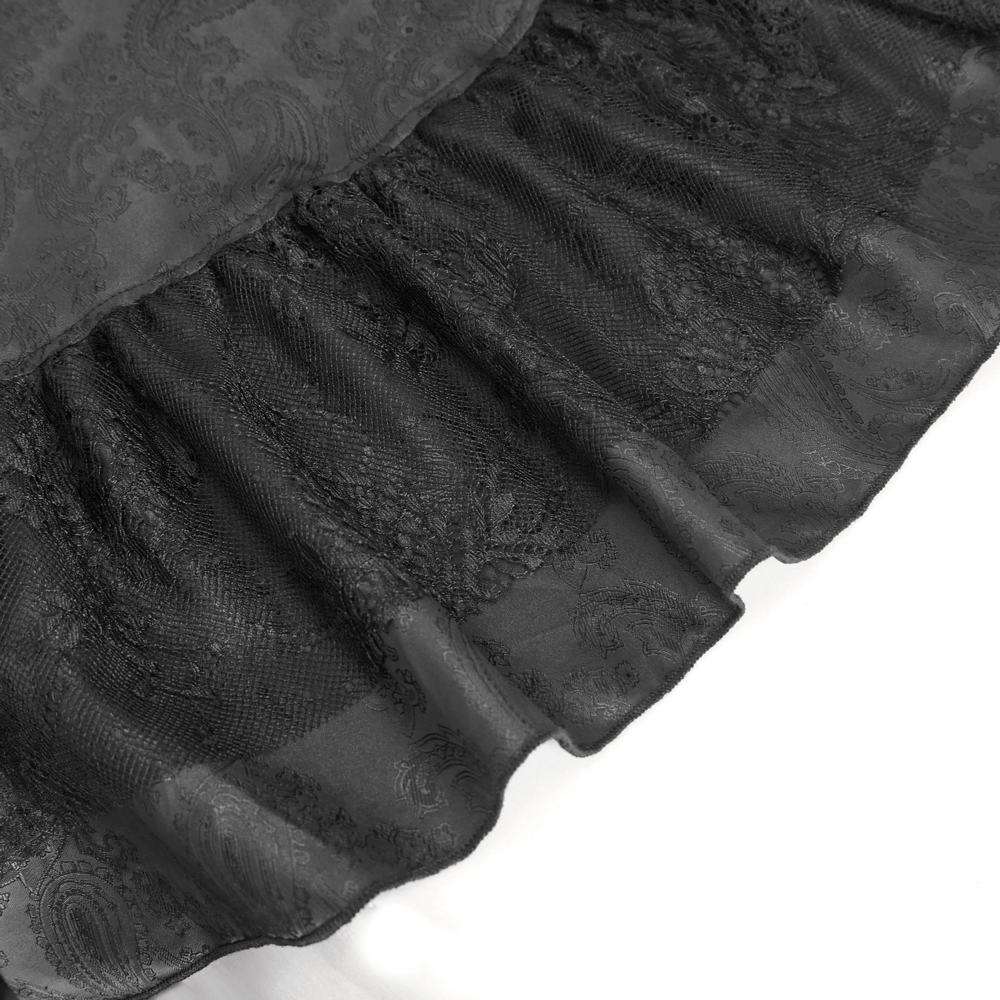 Close-up of elegant Gothic Victorian lace skirt showing intricate lace and dramatic ruffles detail.