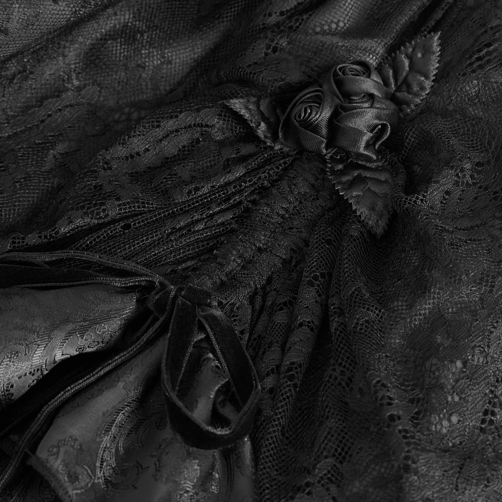Close-up of elegant Gothic Victorian lace skirt featuring intricate floral details and dramatic ruffles in black.