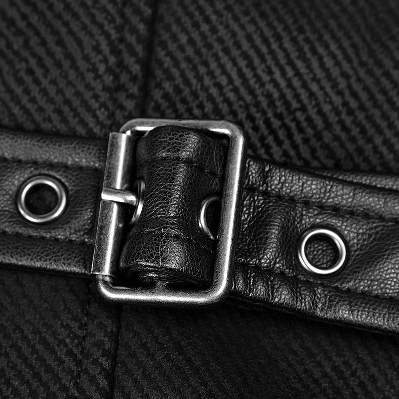 Close-up of vintage gothic waistcoat buckle detail, showcasing leather strap and metal hardware.