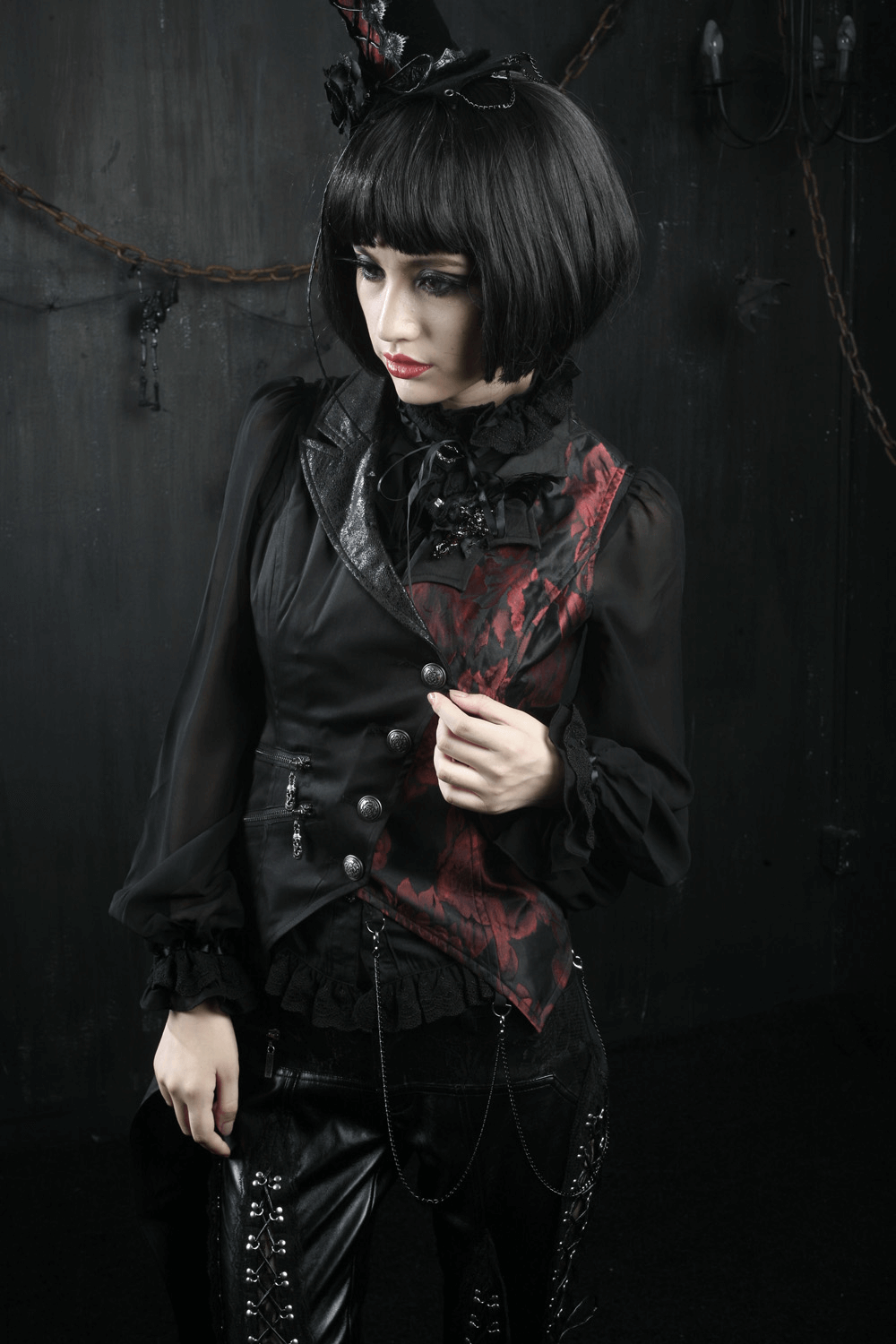 Elegant gothic women's asymmetrical black-red waistcoat styled with lace and corset elements.