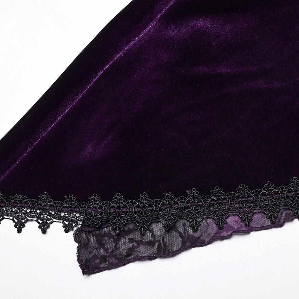 Close-up of luxurious purple velvet fabric with intricate black lace detailing.