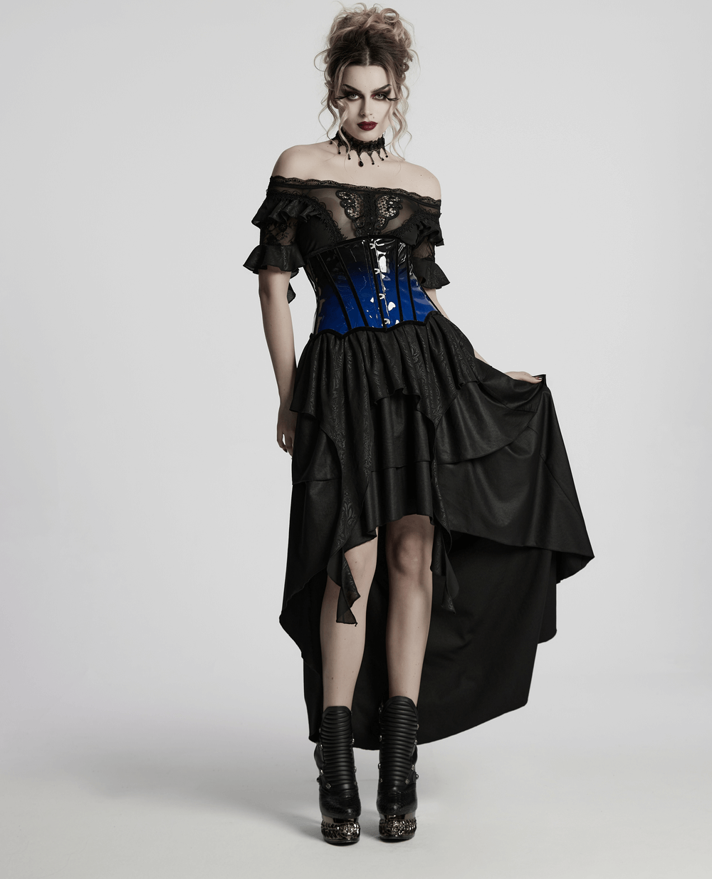 Model showcasing an elegant gradient patent leather goth underbust corset with a dramatic black and blue dress.