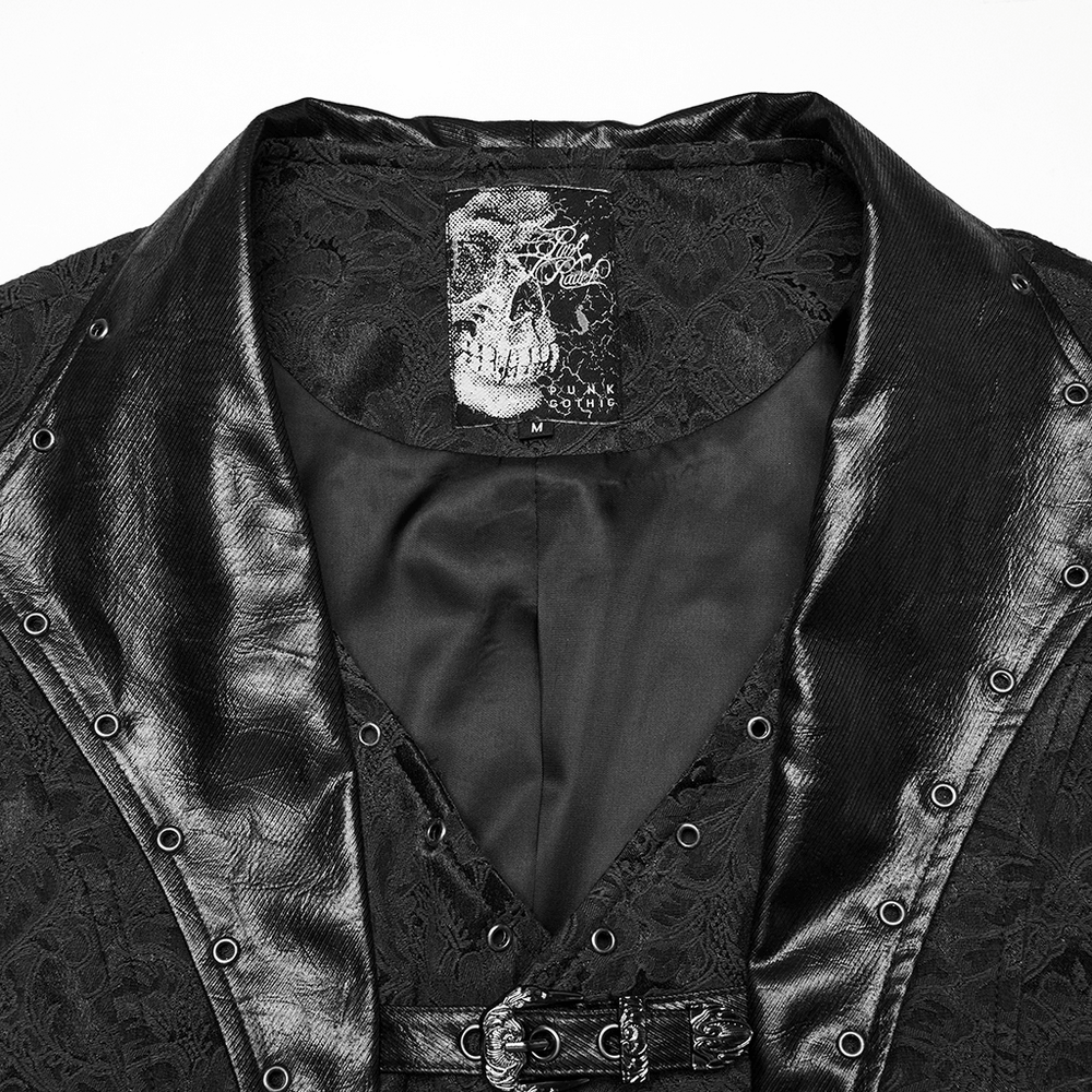 Close-up of gothic jacquard waistcoat with skull label, leather lapel, and eyelets for a dark, stylish look.