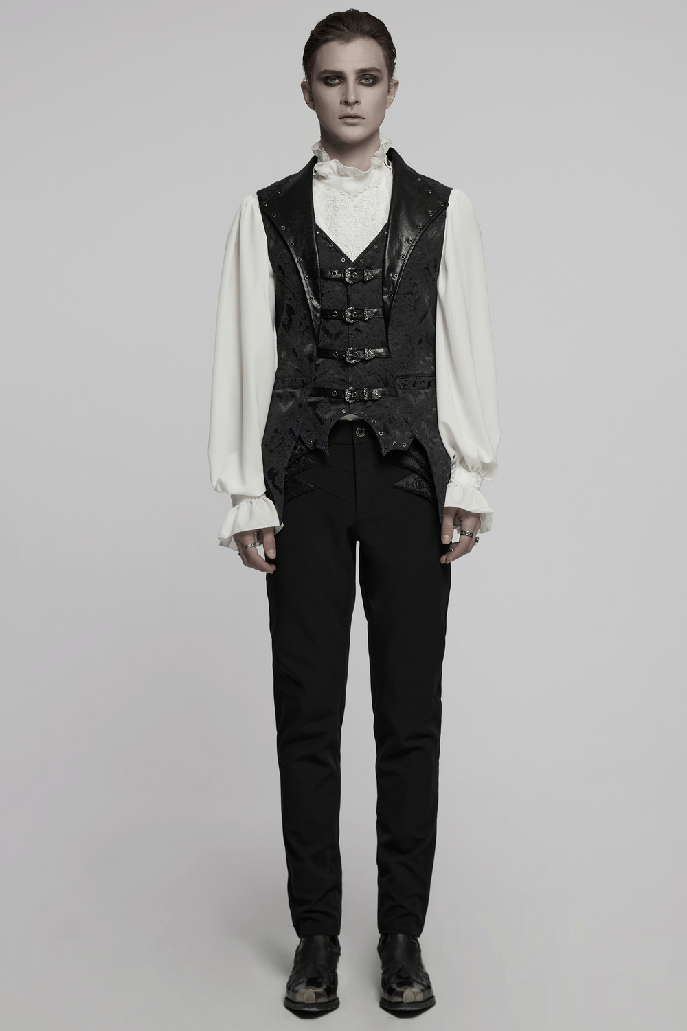 Gothic jacquard waistcoat with leather and buckles, bat hem design, styled for a dark, elegant look.