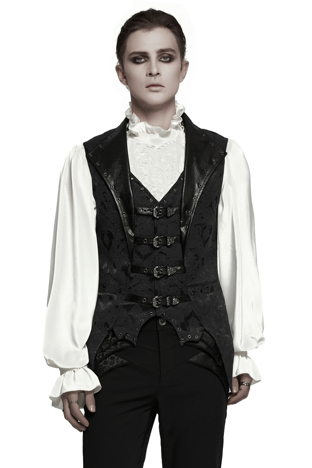 Elegant gothic jacquard waistcoat with buckles, bat hem, and textured leather, worn with a white blouse.