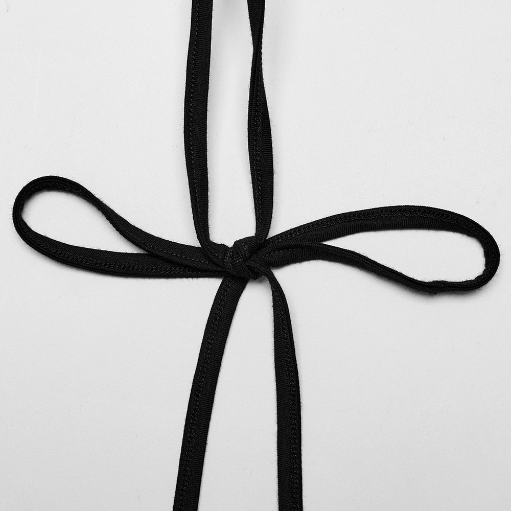 Close-up of a black fabric ribbon tied in a decorative knot, perfect for fashion detailing or crafting.