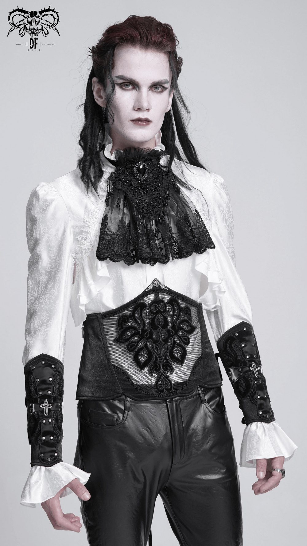 Model showcasing a chic gothic black lace and mesh corset belt with intricate floral embroidery and dramatic white shirt.