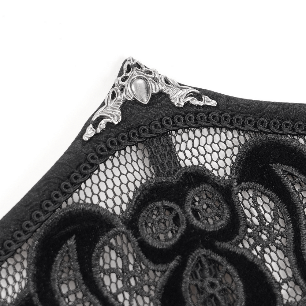 Close-up of elegant black lace and mesh corset belt with intricate floral embroidery and decorative silver detailing.