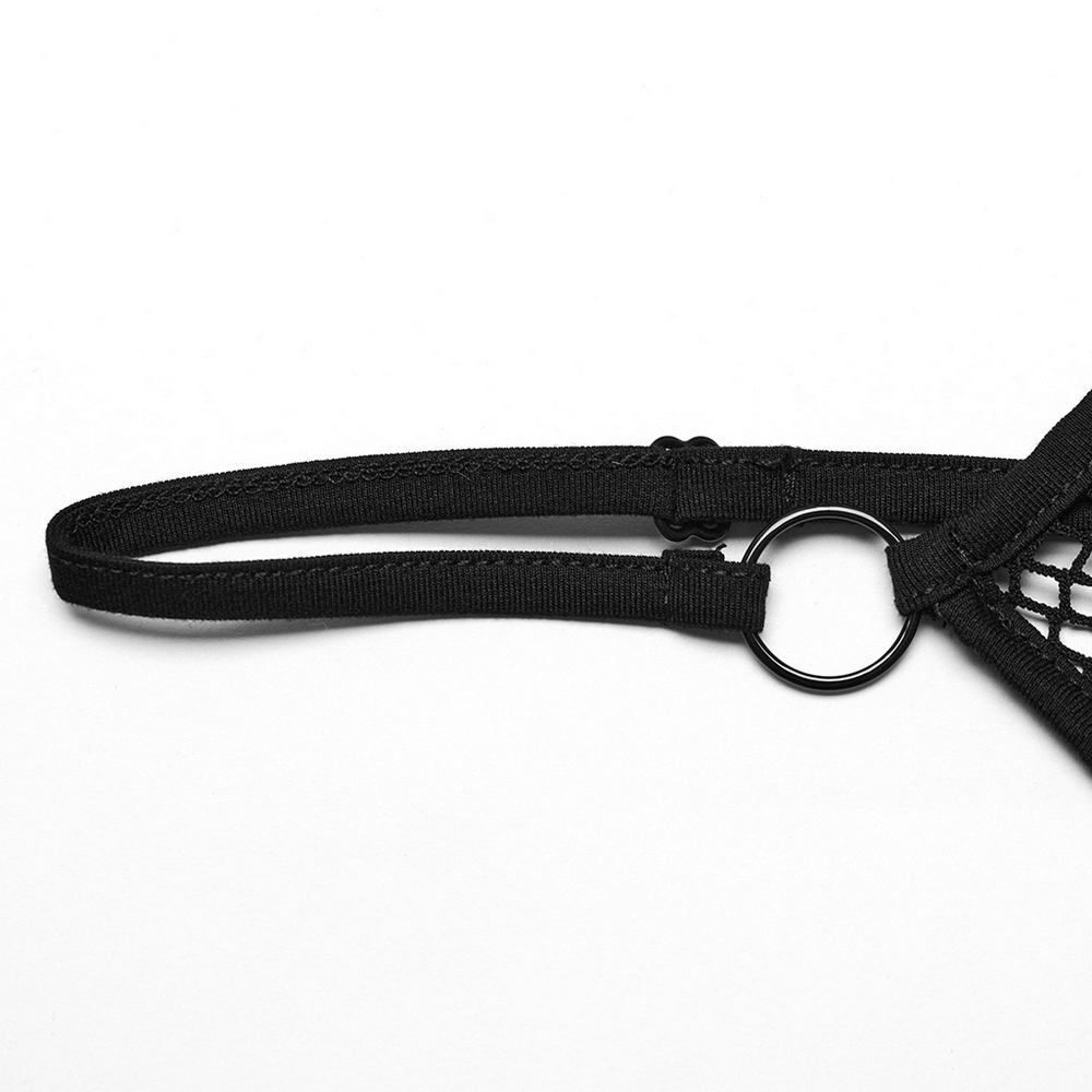 Close-up of adjustable shoulder strap and ring detail on black lace mesh cami top.