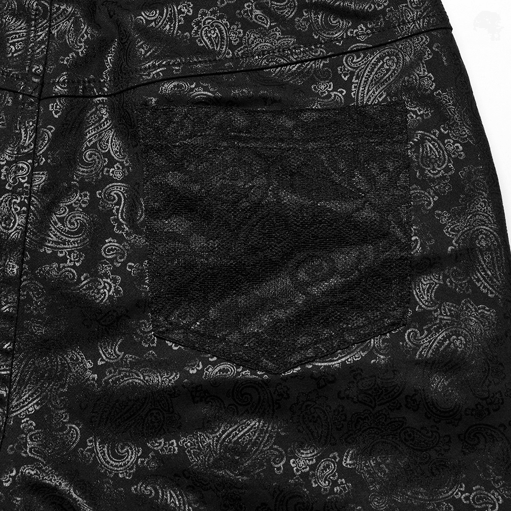 Close-up of elegant black leggings featuring shimmering lace and intricate patterned design.