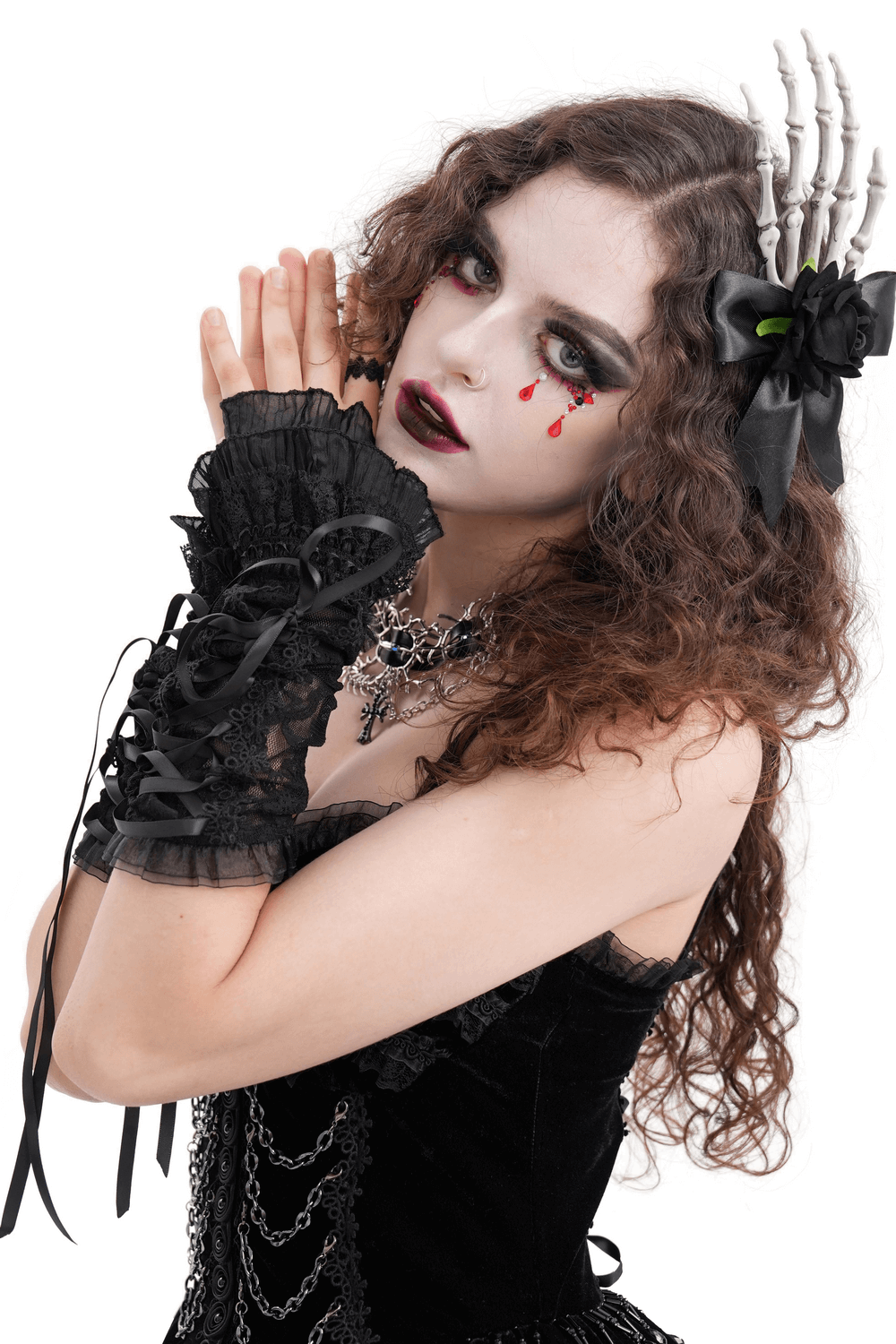 Gothic Victorian model wearing lace arm warmers with satin ribbons, dramatic makeup, and stylish accessories.