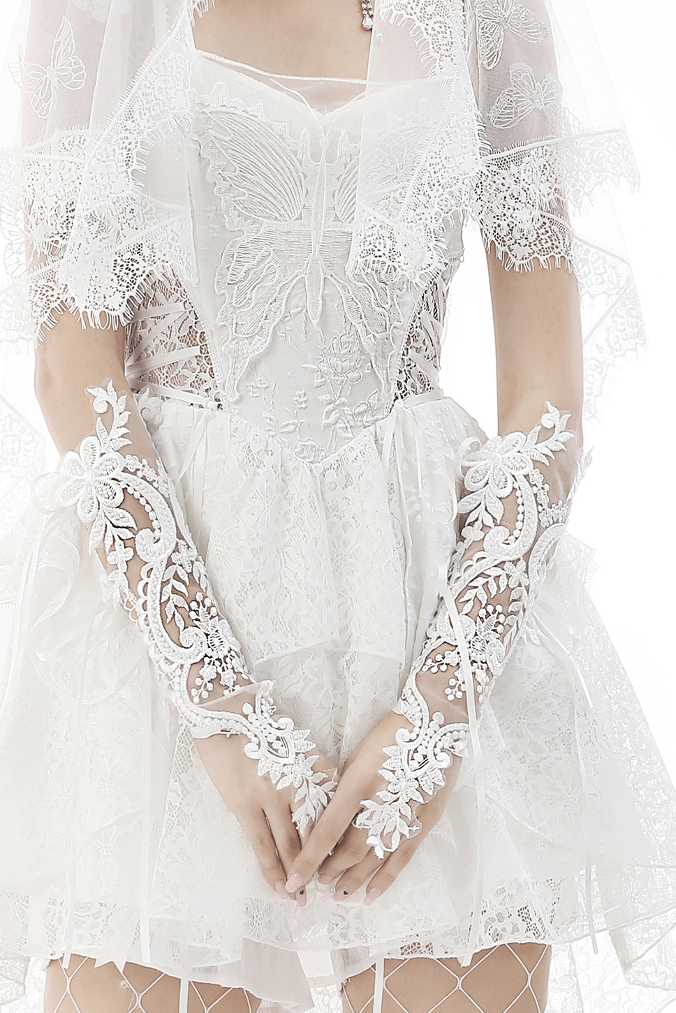 Elegant lace bridal gloves with floral embroidery, adding sophistication to wedding attire.