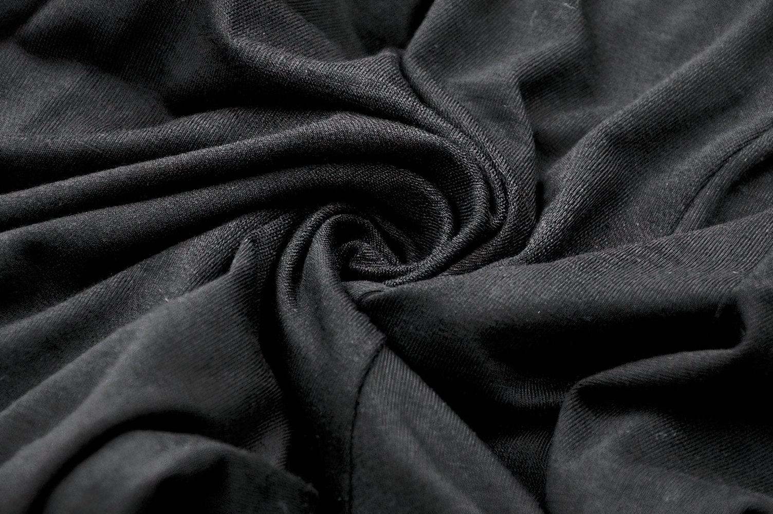 Elegant Lace Flare Pants with Layered Ruffled Hem Design fabric close-up.