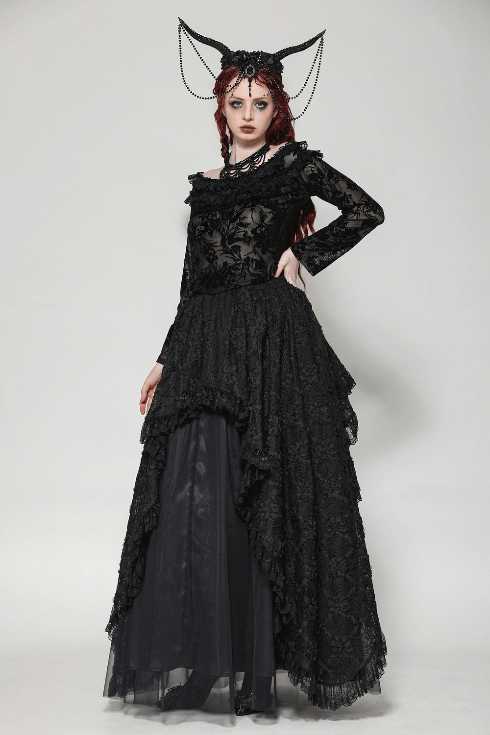 Gothic-inspired model in elegant lace floral Bardot top and flowing black skirt, showcasing a dark romantic aesthetic.