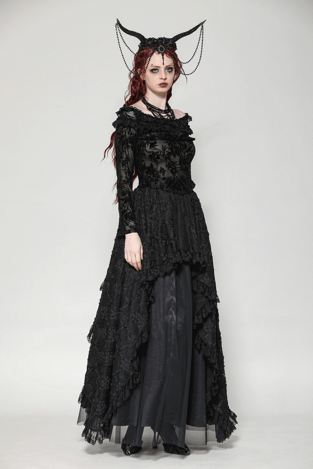 Elegant off-shoulder black lace top with long sleeves, perfect for gothic and romantic evening wear.