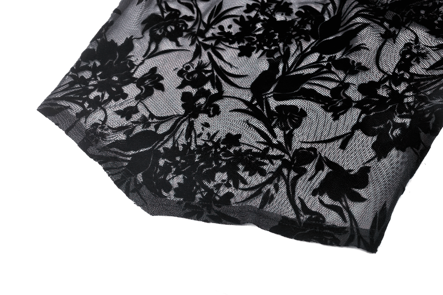 Close-up of dark floral lace fabric with intricate designs, perfect for an elegant Bardot top.