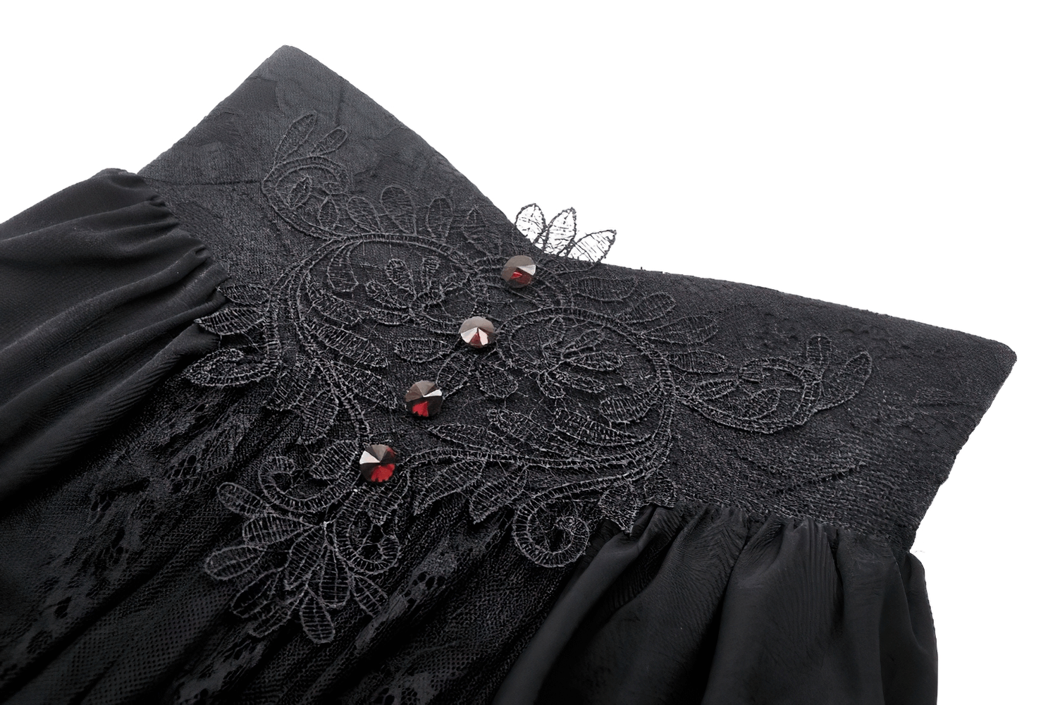 Close-up of black gothic lace detailing and button accents on a high waist maxi skirt.