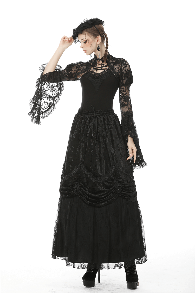 Elegant black lace long sleeve bolero top worn over a gothic styled skirt, perfect for a romantic dark fashion look.