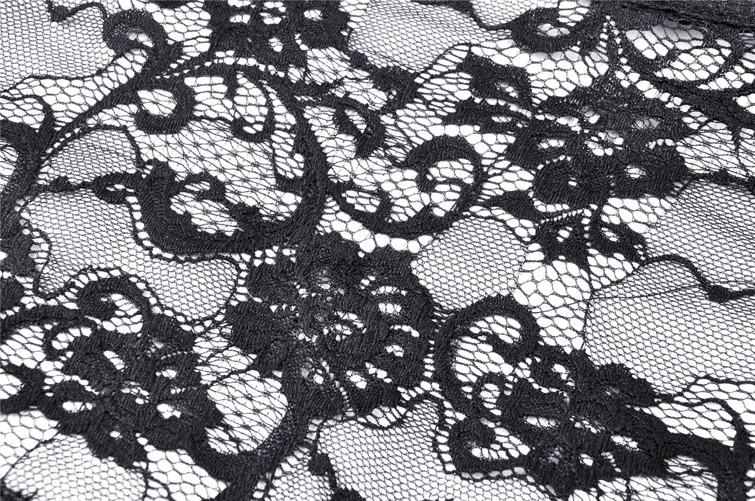 Close-up of elegant black lace featuring floral patterns, perfect for gothic fashion and layering in dark romantic outfits.