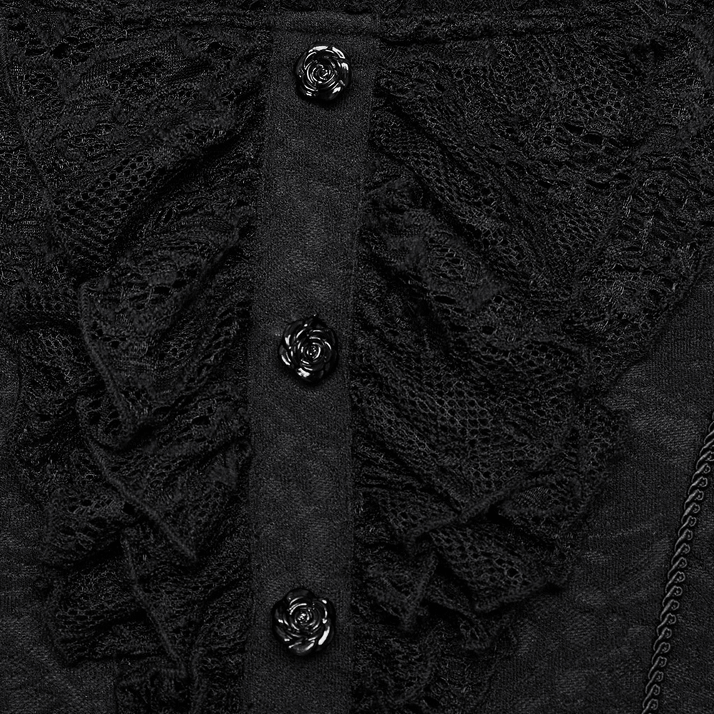 Close-up of black lace ruffle top featuring glossy rose buttons and intricate knit fabric detail.