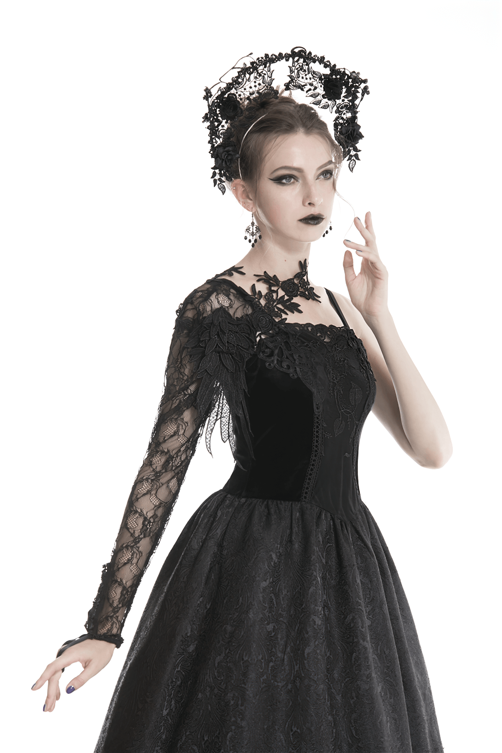 Gothic lace sleeve accessory worn by woman in black dress, with floral appliques and elegant hairstyle.