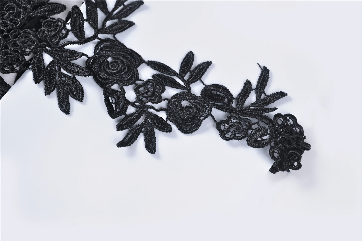 Elegant black lace sleeve accessory with floral appliques, perfect for gothic and dark fashion outfits.