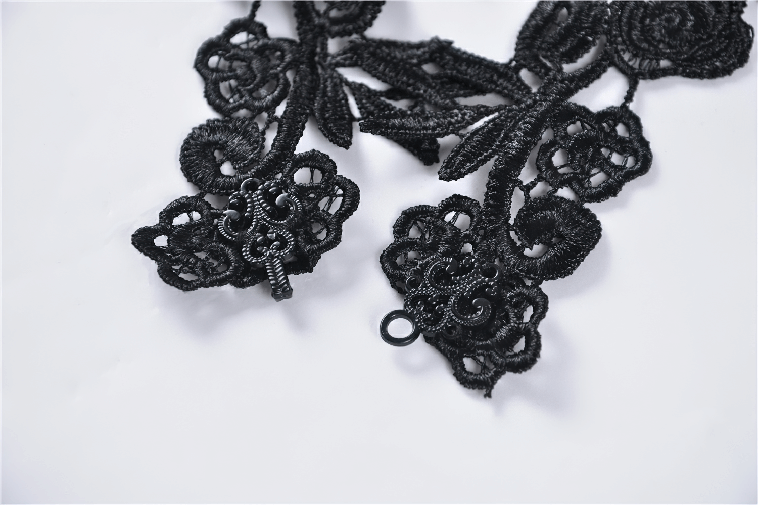 Elegant black lace sleeve accessory with intricate floral appliques for gothic fashion.