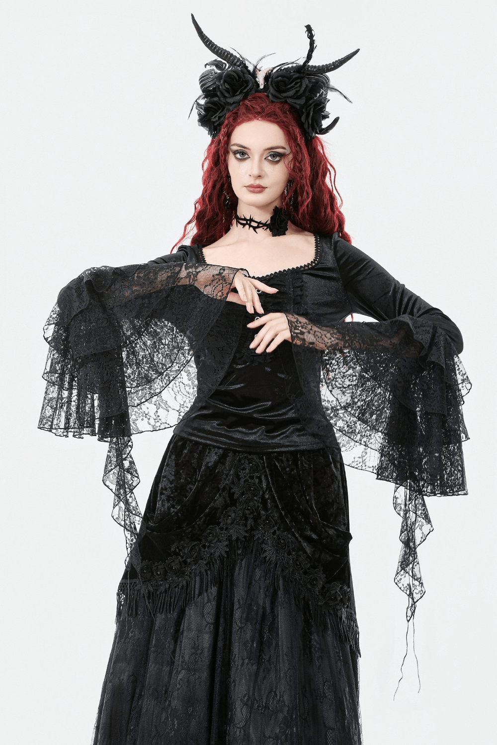 Elegant Lace Sleeve Gothic Velvet Top with Ruffle Details worn by a model against a white background.
