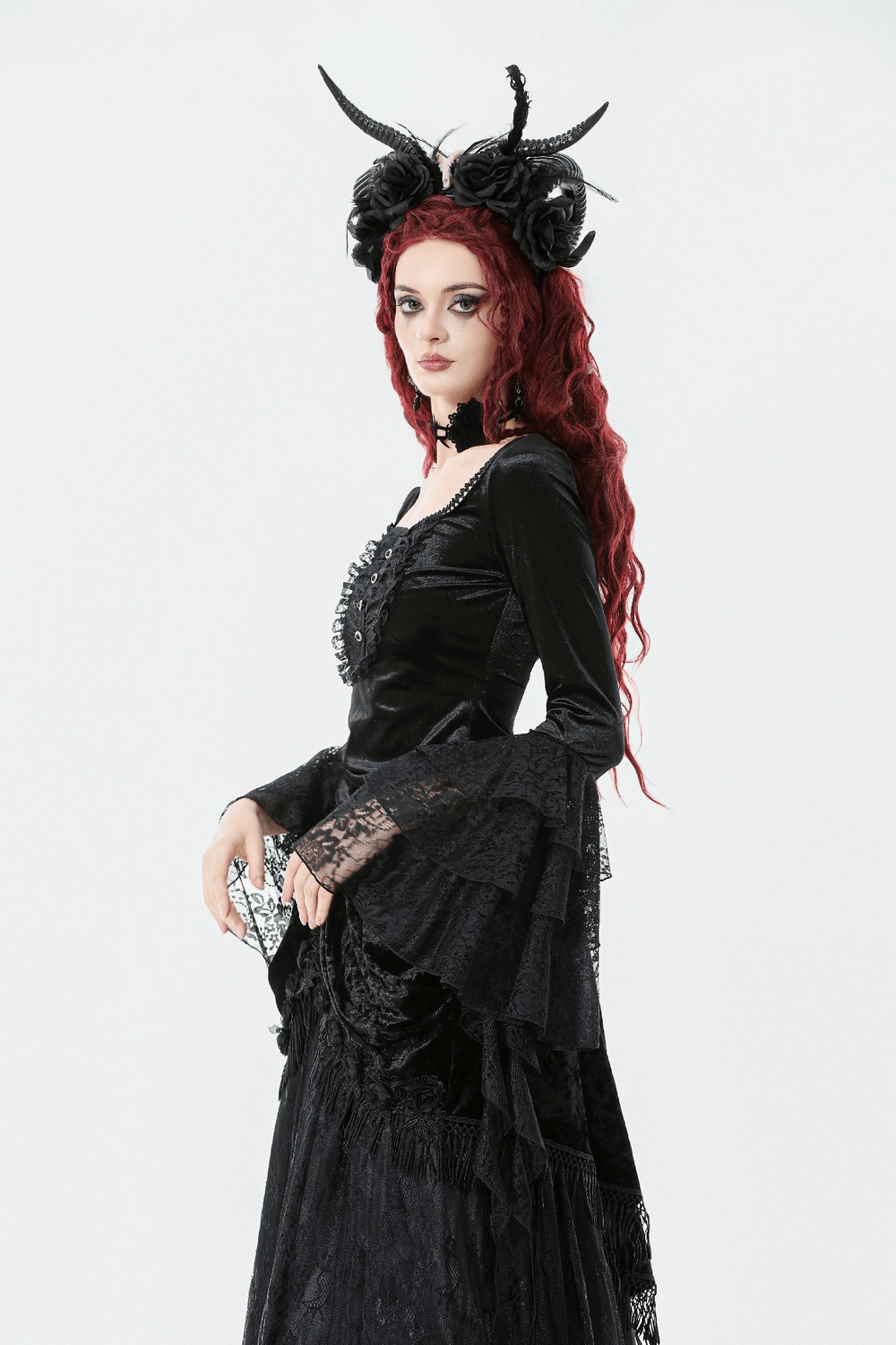 Elegant Lace Sleeve Gothic Velvet Top with Ruffle Details showcased on a model with striking accessories.