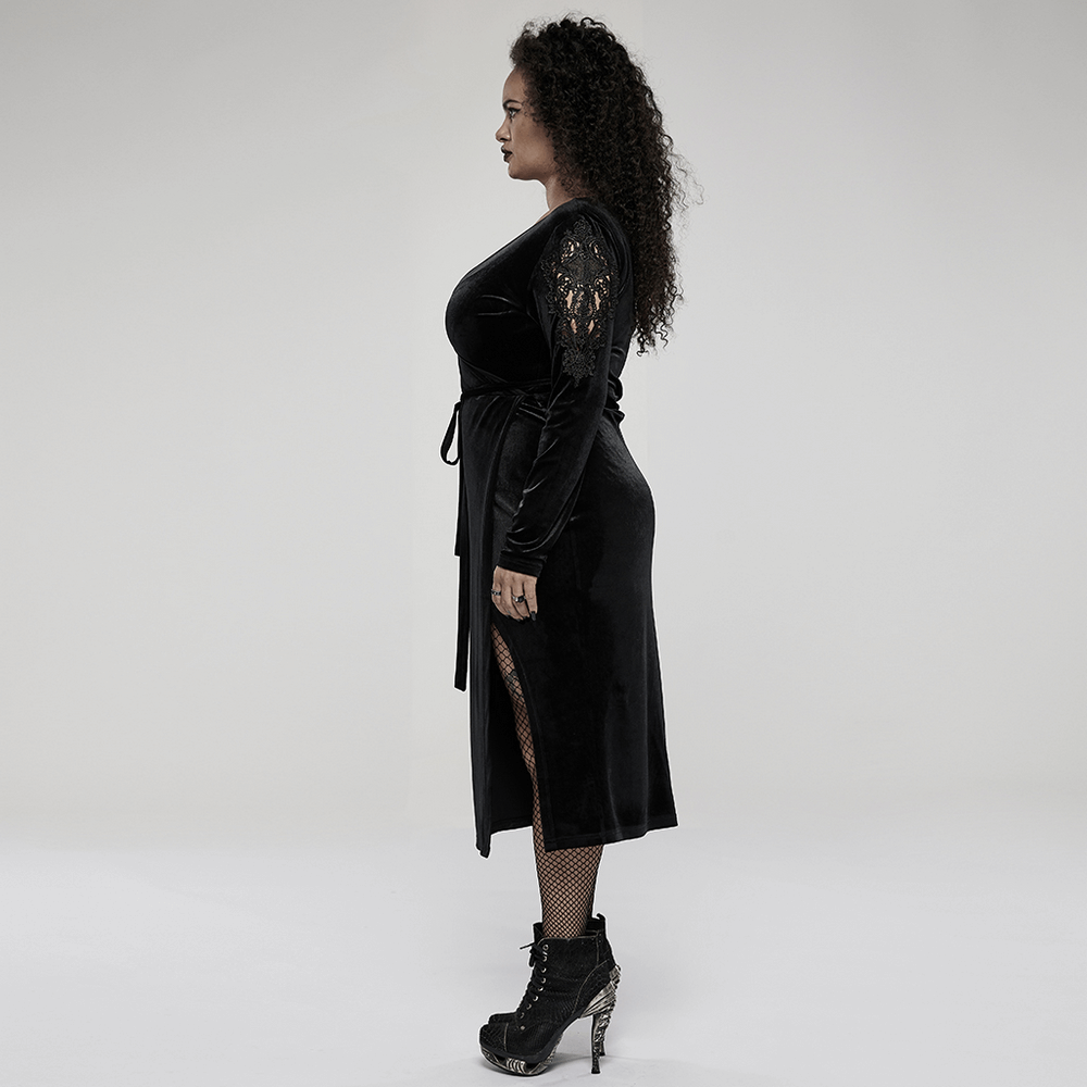 Elegant black velvet midi dress with lace sleeves and side slit, styled for a chic goth look.