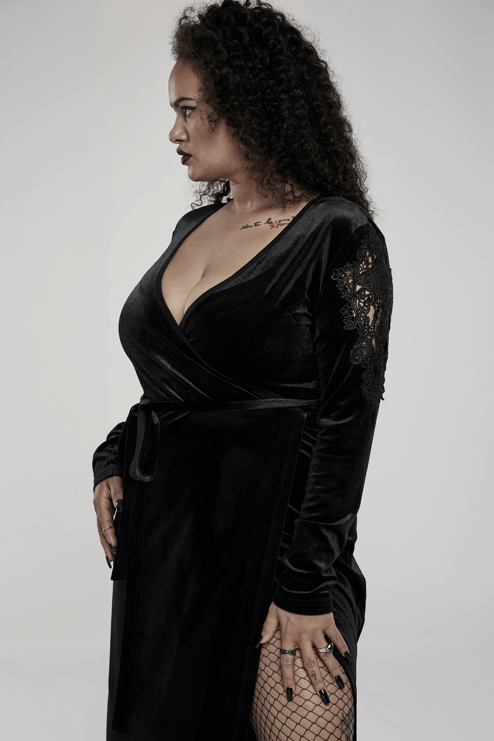 Elegant velvet midi dress with lace sleeves, showcasing a figure-flattering V-neck and accentuating gothic charm.