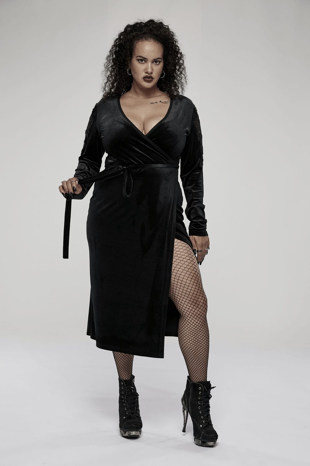 Chic goth velvet midi dress with lace sleeves, V-neck, and side slit, perfect for elegant evenings.