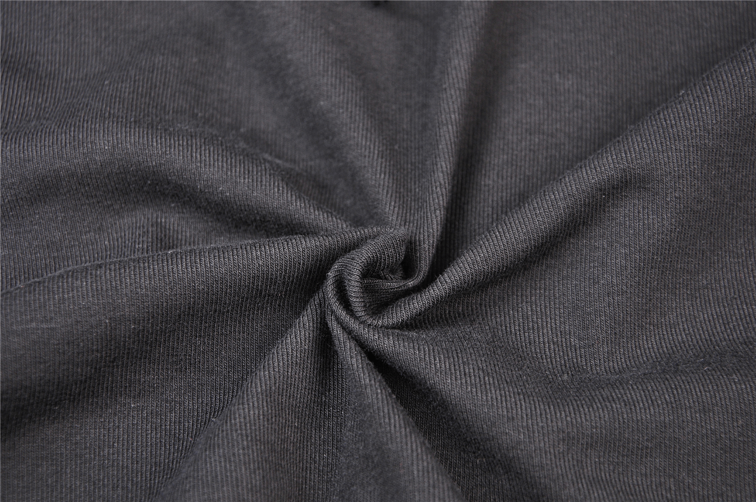 Close-up of soft, stretchy black fabric ideal for a bodycon dress, showcasing texture and elegance.