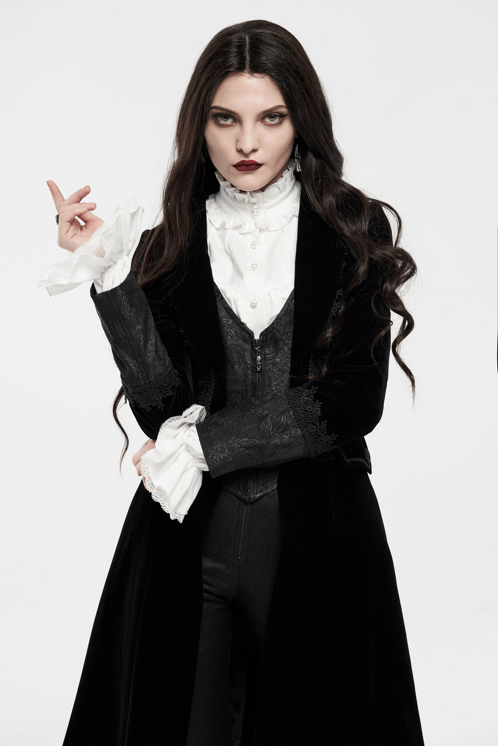 Elegant woman in a lace-trimmed Gothic long coat with a striking collar and sleeves, exuding mysterious allure.