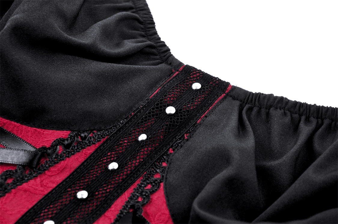 Close-up of elegant burgundy and black corset with intricate lace and embellishments, showcasing Victorian goth style.