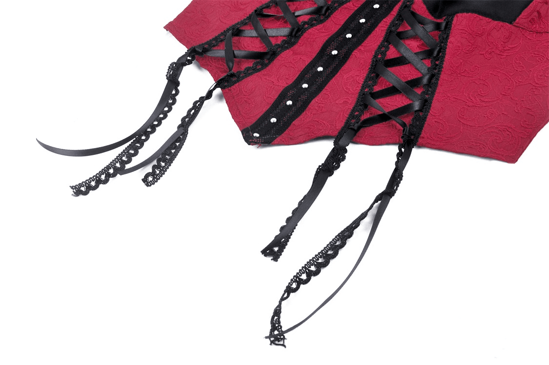 Close-up of elegant burgundy corset showing black lace-up details and ties, perfect for gothic fashion.